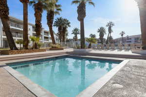 Community pool with a patio area