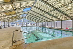 View of pool featuring a sunroom