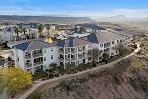Aerial view of mountains and apartment complex / building