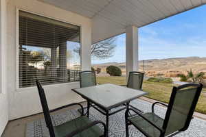 View of patio / terrace with outdoor dining area and a mountain view