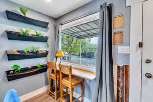 Dining space with light wood-type flooring and baseboards