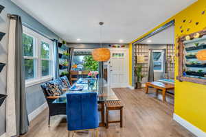 Dining space with light wood-type flooring and recessed lighting