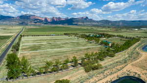 Aerial view of sparsely populated area featuring a mountainous background