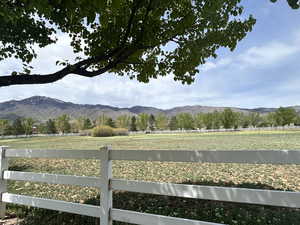 View of mountain backdrop featuring rural landscape