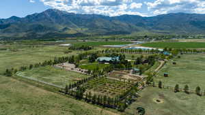 View of mountain backdrop with rural landscape and a pastoral area