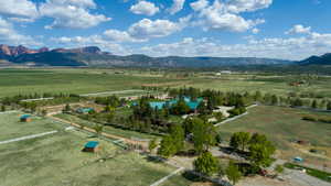 Overview of rural landscape featuring a mountain backdrop