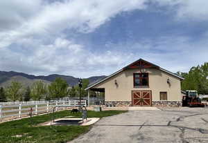 Horse barn featuring a mountain view