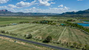 Overview of rural landscape featuring a water and mountain view