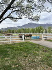 View of mountain backdrop with rural landscape and agricultural land