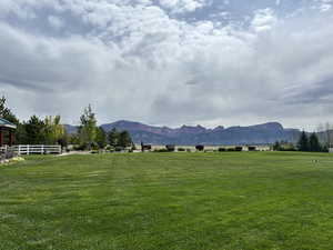 View of mountain background featuring rural landscape