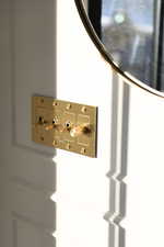 Upgraded brass light switches on main floor