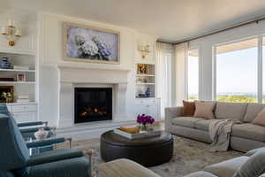 Floor to ceiling windows and gas fireplace