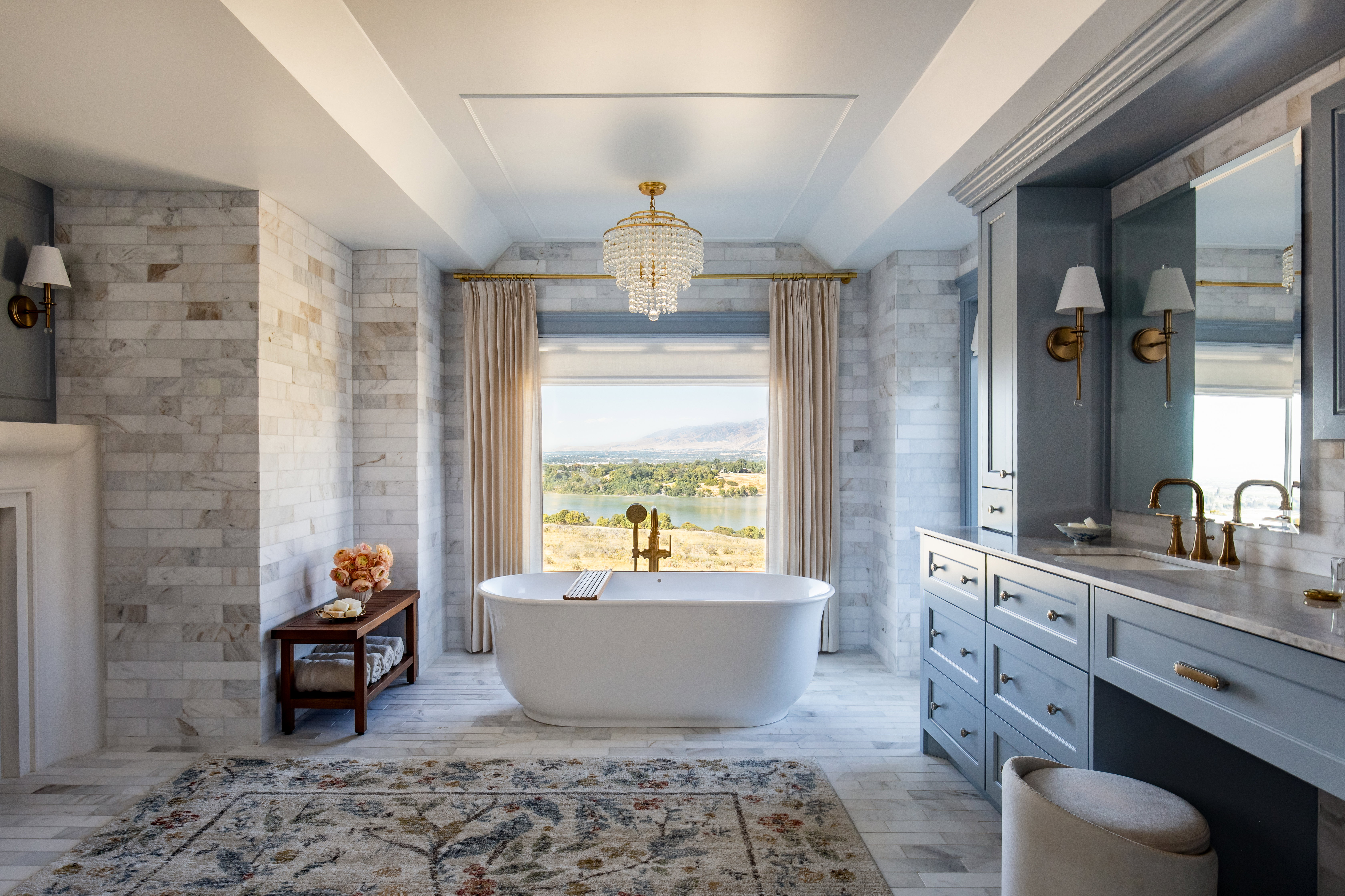 Master bath, stand alone tub surrounded by windows and cozy curtains