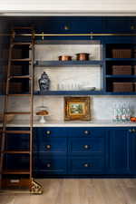 Marble throughout, pocket doors and sliding ladder