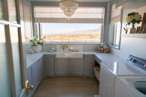 Laundry room with mountain and lake view