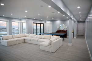 walk out basement featuring a double stacking slide door