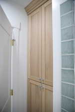 large white oak storage in basement bathroom