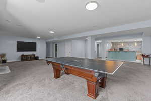 Game room featuring light carpet
