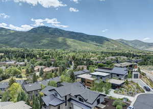 Aerial view of residential area featuring a mountainous background