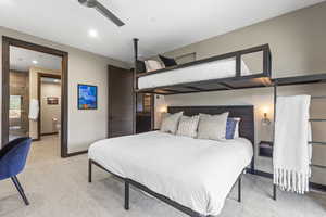 Bedroom with light colored carpet, a ceiling fan, and recessed lighting