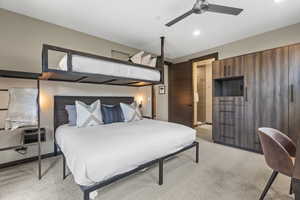 Bedroom featuring light carpet and ceiling fan