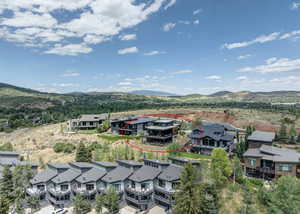 Aerial view of residential area featuring mountains