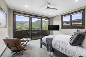 Bedroom with access to exterior, carpet floors, a ceiling fan, and recessed lighting