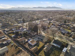 Aerial perspective of suburban area with a mountain backdrop