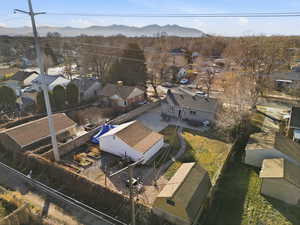 Aerial view of residential area featuring a mountain backdrop