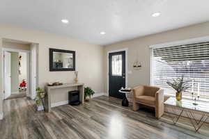 Entryway featuring laminate floors and recessed lighting