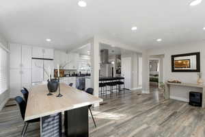 Dining room featuring light wood-style flooring and recessed lighting