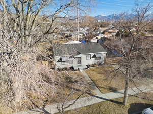 Aerial view of residential area featuring a mountain backdrop