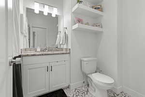Bathroom with vanity and light tile patterned floors