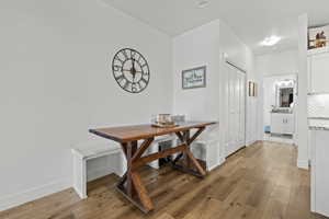 Dining room featuring light wood-type flooring and breakfast area