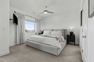 Master Bedroom featuring ceiling fan and light colored carpet