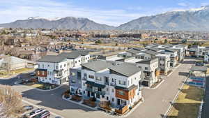 Aerial perspective of suburban area with a mountain backdrop