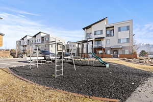 Communal playground featuring a residential view