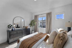 Bedroom with carpet flooring and baseboards