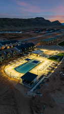 Community pool with a mountain view and a residential view