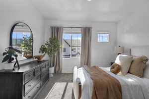 Bedroom with carpet floors and baseboards