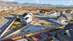 Aerial perspective of suburban area featuring a mountainous background