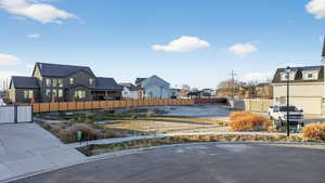 View of yard with a residential view and a gate