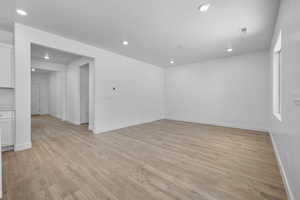 Unfurnished room with light wood-style flooring and recessed lighting