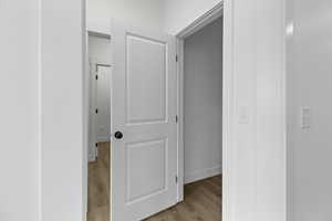 Hall featuring light wood-type flooring