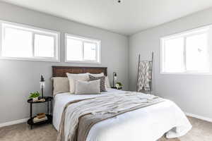 Bedroom with carpet and baseboards