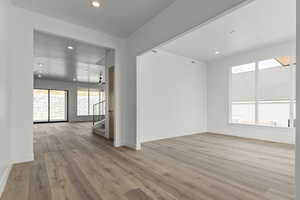 Unfurnished room with recessed lighting and light wood-style floors