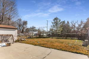 View of yard featuring a patio and a residential view