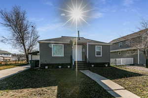 Bungalow-style home featuring a shingled roof