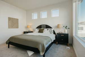 Bedroom with carpet flooring and baseboards
