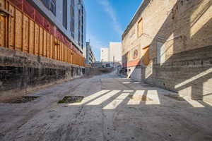 View of concrete alley